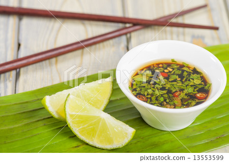 Southeast Asian dip with chilli coriander and fish sauce Southeast Asian dip with chilli coriander and fish sauce 13553599
