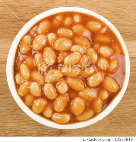 Baked Beans - Bowl of baked beans in tomato sauce. Baked Beans - Bowl of baked beans in tomato sauce. 13553619