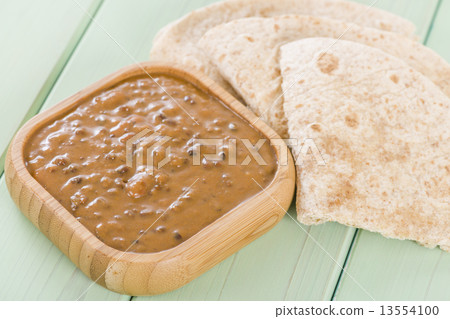 Dal Makhani - Indian dish made with black lentils and spices  served with chapatis.   13554100