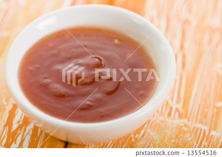 Sweet Chili Sauce - Asian style sweet chili sauce on a crackled orange background. Sweet Chili Sauce - Asian style sweet chili sauce on a crackled orange background. 13554516