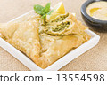 Borek - Middle Eastern spinach and cheese stuffed pastry served with hummus and lemon wedges. 13554598