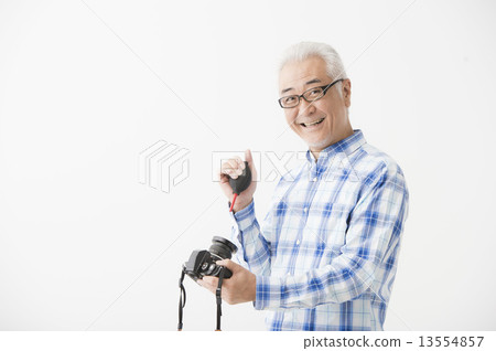 Senior male with camera 13554857