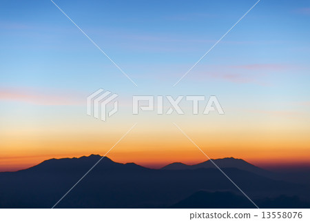 Mountain silhouette on a gorgeous sunrise Mountain silhouette on a gorgeous sunrise 13558076