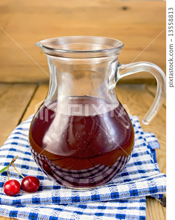 Compote cherry in glass jar on board 13558813