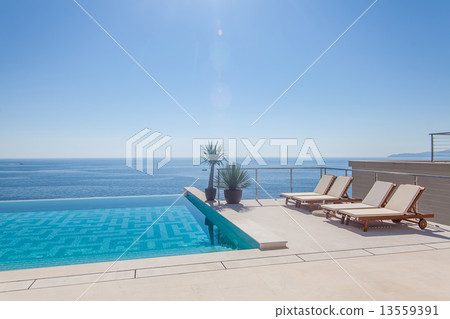 Luxury swimming pool and blue water 13559391