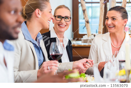 Business lunch in restaurant with food and wine 13563070