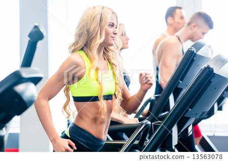 Treadmill group exercising in fitness gym 13563078