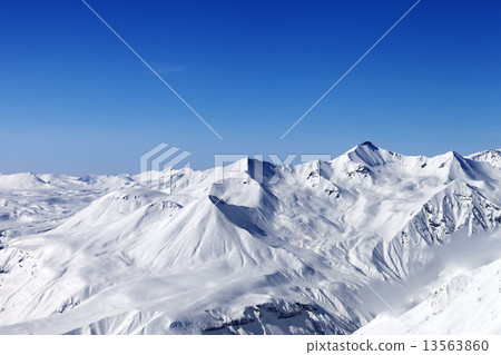 Snow mountains and blue clear sky Snow mountains and blue clear sky 13563860