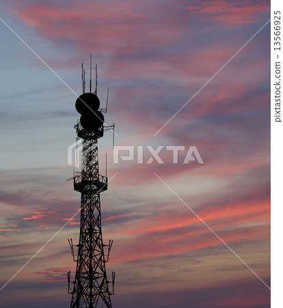 silhouette communicatios tower  against the sky 13566925