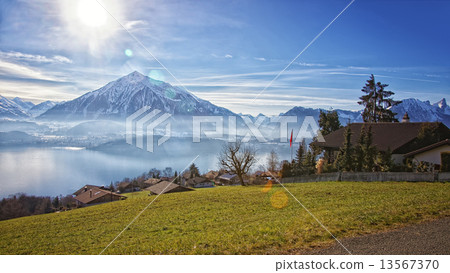 Beautiful view near Thun lake in Swiss Alps 13567370