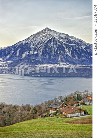 Niesen Mountain and lakeview near Thun lake in Swiss Alps in win Niesen Mountain and lakeview near Thun lake in Swiss Alps in win 13567374