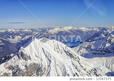 Niesen swiss alpine peak and Brienz lake winter helicopter view Niesen swiss alpine peak and Brienz lake winter helicopter view 13567375