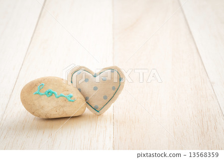 Cute handmade heart and glitter love word on stone Cute handmade heart and glitter love word on stone 13568359