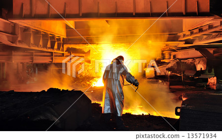 worker with hot steel 13571934