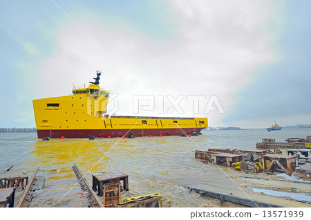 launching ceremony of a ship in the shipyard 13571939