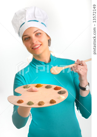 Spices and herbs on the palette and cook girl Spices and herbs on the palette and cook girl 13572149