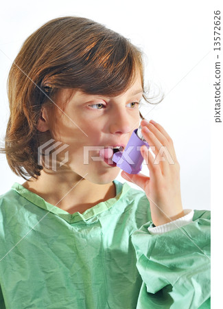 little girl using inhaler little girl using inhaler 13572626