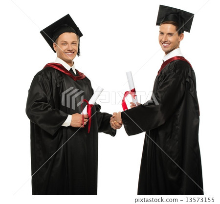 Cheerful young graduated student men shaking hands Cheerful young graduated student men shaking hands 13573155