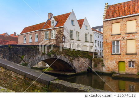 Green canal and bridge in Bruges, Belgium Green canal and bridge in Bruges, Belgium 13574118