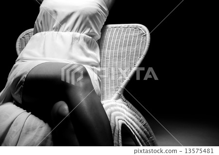 Woman sitting in a chair Woman sitting in a chair 13575481