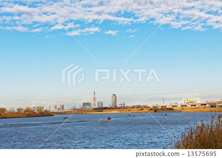 Arakawa spreading blue sky and numerous sea kayak 13575695