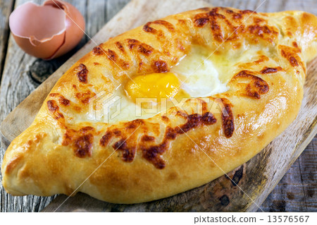 Georgian cheese pie and yolk closeup. 13576567