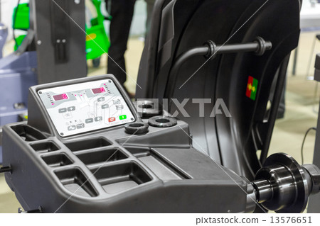 Wheel balancing close up Wheel balancing close up 13576651