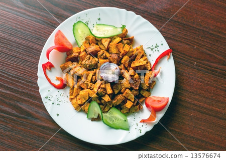 Delicious food on white plate 13576674