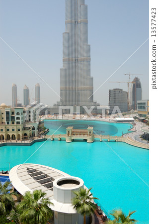 The bridge over man-made lake in Dubai downtown. It is located in Burj Khalifa complex near Dubai Ma 13577423