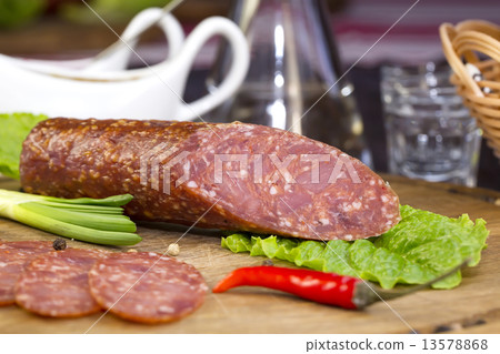 sausage on a wooden plate in a restaurant sausage on a wooden plate in a restaurant 13578868