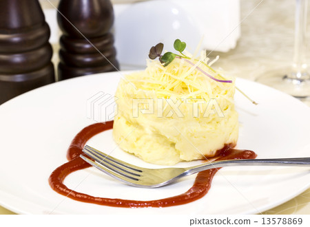 mashed potatoes with herbs and cheese on a white background in the restaurant mashed potatoes with herbs and cheese on a white background in the restaurant 13578869