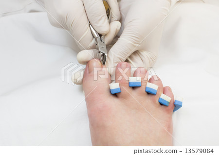 process of pedicure at beauty salon 13579084
