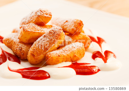 dessert from cottage cheese with sauce 13580869