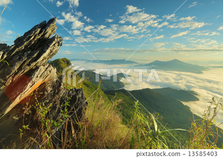 Mountain Rock over mist 13585403