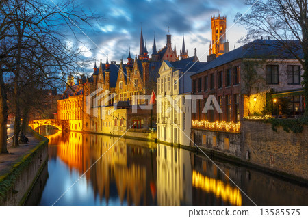 Cityscape with a tower Belfort and the Green canal in Bruges at Cityscape with a tower Belfort and the Green canal in Bruges at 13585575