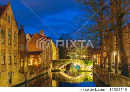 Cityscape with a tower Belfort and the Green canal in Bruges at  13585749