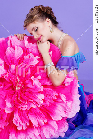 Beautiful belly dancer wearing a purple costume Beautiful belly dancer wearing a purple costume 13588528