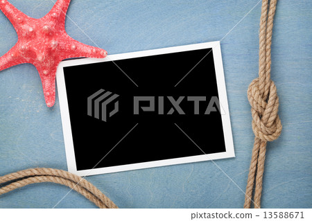 Blank photo frame with starfish and ship rope Blank photo frame with starfish and ship rope 13588671