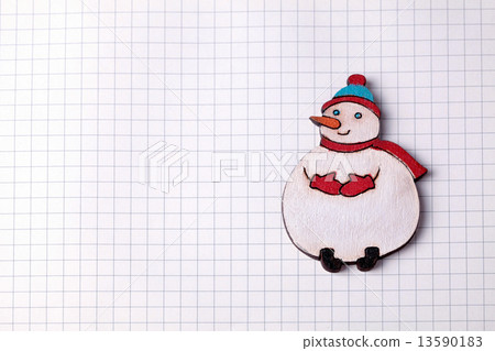Handmade wood christmas decoration snowman on squared paper 13590183