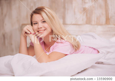 Beautiful woman waking up in the bed Beautiful woman waking up in the bed 13590900