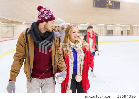 happy friends on skating rink 13594050