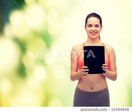 sporty woman with tablet pc blank screen 13594649