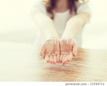 close up of little girl showing empty cupped hands close up of little girl showing empty cupped hands 13594712