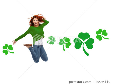 smiling teenage girl jumping in air with shamrock smiling teenage girl jumping in air with shamrock 13595119