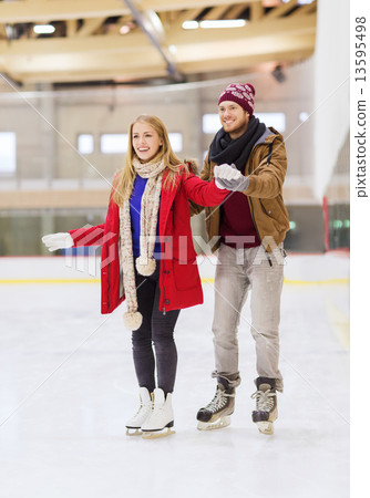 happy couple on skating rink 13595498