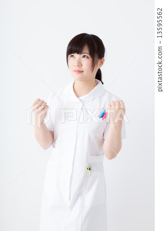 Nurse playing guts pose Nurse playing guts pose 13595562