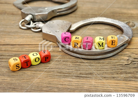 Sign Stop Crime and Handcuffs 13596709