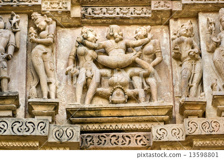 Kamasutra scene on the wall of a Temple in Khajuraho. Kamasutra scene on the wall of a Temple in Khajuraho. 13598801