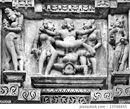 Kamasutra scene on the wall of a Temple in Khajuraho. Kamasutra scene on the wall of a Temple in Khajuraho. 13598845