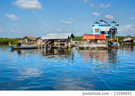 Floating House and Houseboat on the Tonle Sap lake, Cambodia. Floating House and Houseboat on the Tonle Sap lake, Cambodia. 13598891